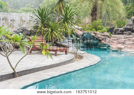 Beautiful luxury home and chair around outdoor swimming pool in hotel resort - Holiday Vacation concept with copy space