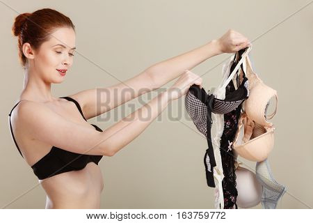 Woman Choosing Bras To Wear