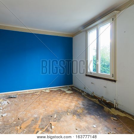 Room in house that no longer exists. Disorder chaos debris and dirt in an abandoned room for demolition.
