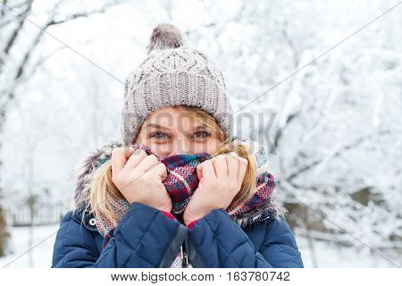 Picture of a young woman feeling cold on wintertime
