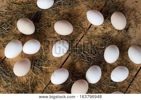 High quality tasty and healthy chicken eggs from domestic hens on wooden mat