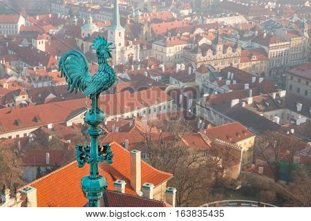 Bronze weathercock at the roof of St Vitus' Cathedral at Prague Castle Czech Republic