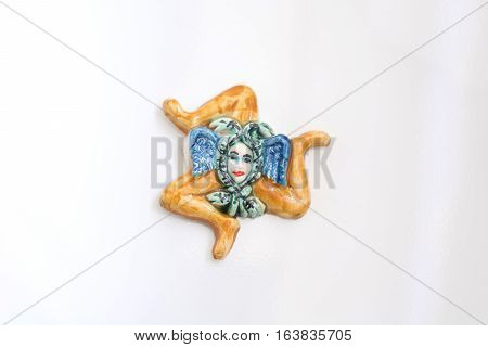 typical sicilian souvenir: Trinacria featuring the triskelion symbol and the Gorgon