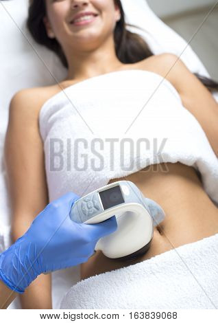beauty treatment of a young woman in specialized clinic