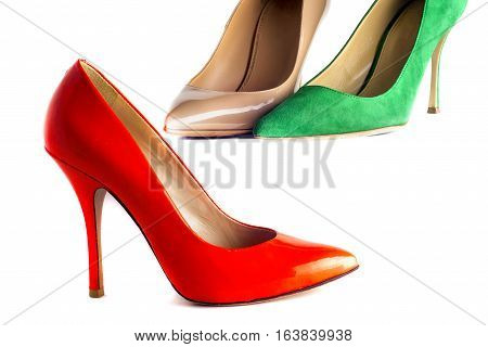 bright multicolored female shoes on high heels isolated on white background