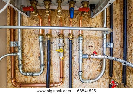 the bottom of the boiler is closed with connection to central heating and hot water