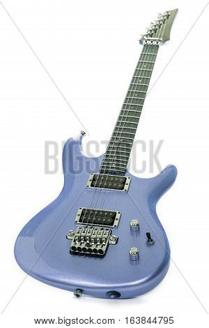 Classic blue electric guitar isolated against white background. Expensive looking modern guitar with metallic paint finish. Luxury item.
