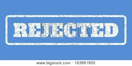White rubber seal stamp with Rejected text. Vector tag inside rounded rectangular frame. Grunge design and dust texture for watermark labels. Horisontal sticker on a blue background.