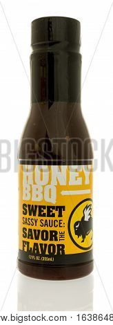 Winneconne WI - 2 January 2017: Bottle of Buffalo Wild Wings honey BBQ sauce on an isolated background.