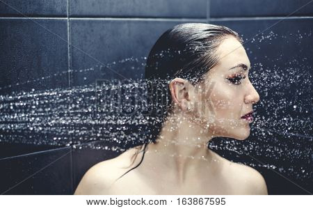 Beautiful sexy  young woman washing body in a shower