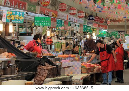 SEOUL SOUTH KOREA - OCTOBER 21, 2016: Unidentified people visit Gwangjang market. Gwangjang market is one of the oldest and largest traditional markets in South Korea with more than 5000 shops.