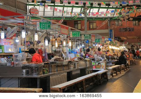 SEOUL SOUTH KOREA - OCTOBER 21, 2016: Unidentified people visit Gwangjang market. Gwangjang market is one of the oldest and largest traditional markets in South Korea with more than 5000 shops.