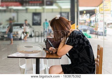 Woman Using Smartphone Wait For Cleaning The Car