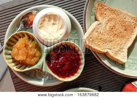 Happy Family Having Breakfast on the tabke