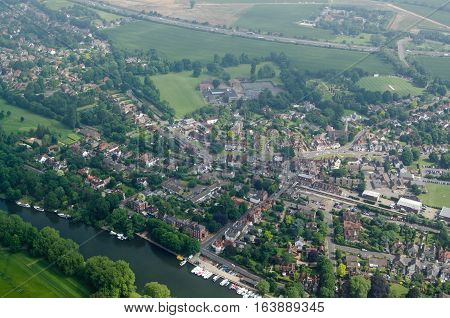 View from a plane of the village of Datchet Berkshire. The historic village lies on the banks of the River Thames near Windsor and has the M4 motorway running to the north.