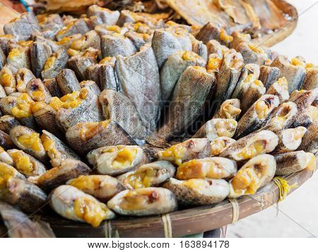 dried salted damsel fish with eggs put on threshing basket