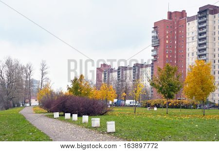 View of park and walkway at golden autumn.