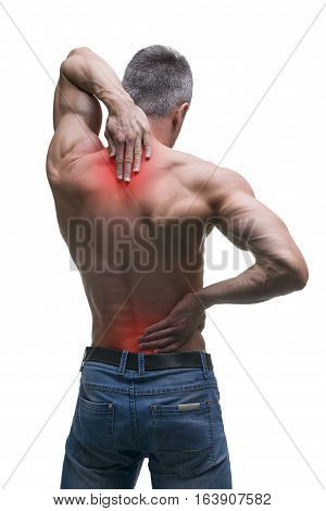 Middle aged man with back pain muscular male body studio isolated shot on white background with red dot