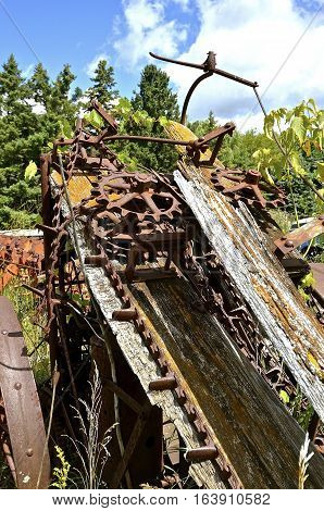 Remnants of a very old corn picker included many gears, chain, and wooden laths.