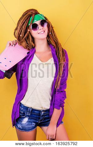 Portrait Of A Young Girl With Skateboard