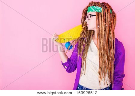 Portrait Of A Young Girl With Skateboard