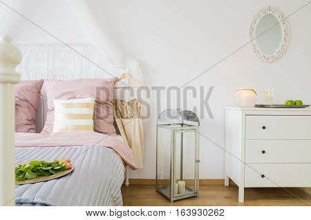 Bed, Dresser And Decorative Lantern