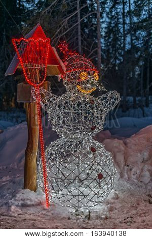 Winter in High Tatras Mountains. High Tatry. Slovakia. Vysoke Tatry. Christmas and New Year decoration.  Illuminated Snowman