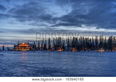 Winter in High Tatras Mountains. High Tatry. Slovakia. Vysoke Tatry. Frozen lake winter trees.