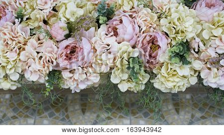 Gorgeous Delicate Flowers Against A Background Of Paving Stones