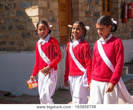 DHARAMSALA, INDIA. 2 Jun 2009: Daily lifestyle. Students go to lessons on a mountain road in the Himalayas. Western Himalayas, Himachal Pradesh, district of Kangra.