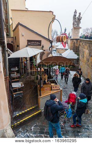 PRAGUE, CZECH REPUBLIC - 03.01.2017: Bakery with czech traditional sweet dessert called trdelnik on the street in the old town of Prague Czech Republic