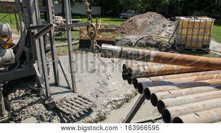 Lifting Drill Pipe On Core Drilling Platform. Drill Pipe on Drilling Rig.