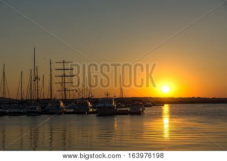 Sozopol, Bulgaria - July 11, 2016: Sunset at the port of Sozopol, Burgas Region, Bulgaria