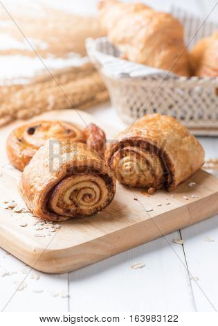 Homemade cinnamon roll bread and bakery on white wood background breakfast food