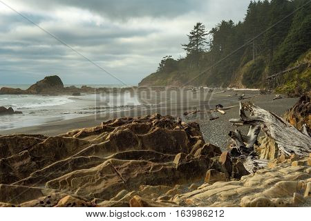 Rock-strewn Kalaloch Beach on Washington's Pacific Coast under a threatening sky