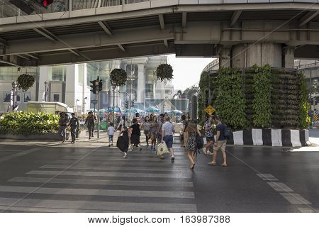 BANGKOK THAILAND - DEC 31 : unidentified tourist walk across crosswalk near Erawan shrine at Ratchaprasong Junction while new year Festival on december 31 2016 thailand.