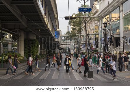 BANGKOK THAILAND - DEC 31 : scene of people walk across crosswalk in off traffic near Erawan shrine while new year Festival on december 31 2016 thailand.