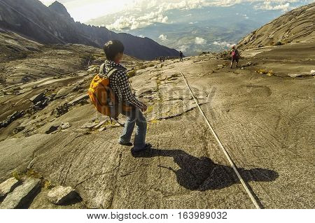 Ranau,Sabah-April 30,2014:Climber move down from Low's Peak to Sayat-Sayat check point of mount Kinabalu,Sabah.Its the highest mountain in Malaysia is one of Borneo's most popular climbers attraction