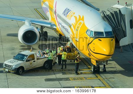 BANGKOK, THAILAND-DEC 29 2016. NOKAIR airline loading cargo on the plane at the gate in Don Mueang international airport (DMK)