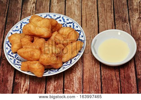 Deep-fried Dough Stick Call Patongko With Sweetened Condensed Milk.