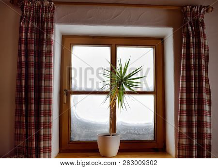 Cozy View From The Window Of The Alpine Chalet On A Snowy Winter Day. View From The Inside. Window W
