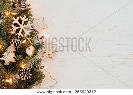 Christmas Background - Fir Leaves And  Rustic Elements Decorating On White Wood Table. Creative Flat