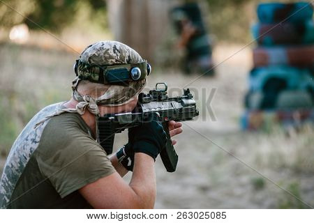 Man Playing Lasertag Shooting Game In Open Air
