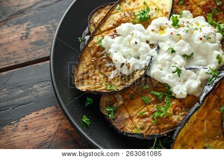 Healthy Vegeterain Oven Baked Aubergines, Eggplant With Cottage Cheese Dip, Parsley And Lemon Wedge.