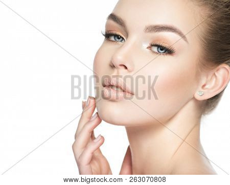 Beautiful face of a young white woman isolated on white background. Girl in beauty style.
