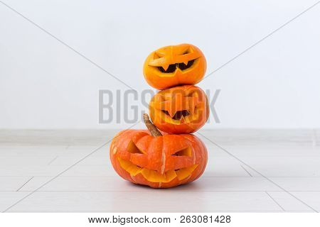 Halloween Pumpkins. Funny Jack Olantern On The Light Room