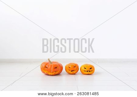 Halloween Pumpkins. Funny Jack Olantern On The Light Room With Copy Space
