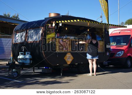 Frankston, Vic / Australia - Oct 13 2018: Woman Pointing At Menu At Food Truck