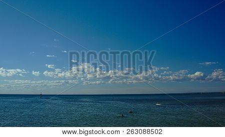 View Of Frankston Beach On A Saturday On Sunny Day With Blue Sky Background