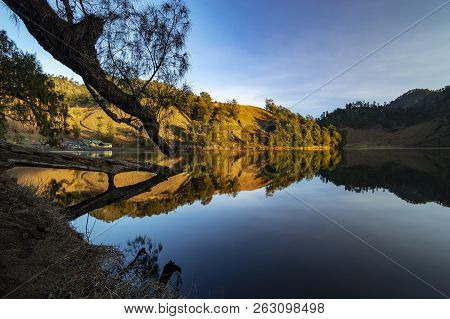 Beautiful Nature Landscape By The Lakeside Will Full Reflection In The Morning.ranu Kumbolo Lake, Se